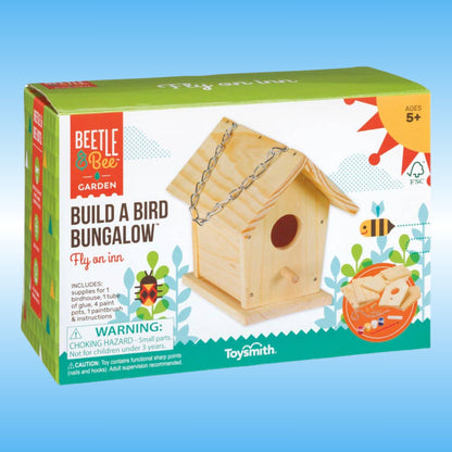 Beetle & Bee Garden 'Build a Bird Bungalow' toy kit box by Toysmith, showing a wooden birdhouse on the front with colorful graphics and age 5+ marking on a light blue background.
