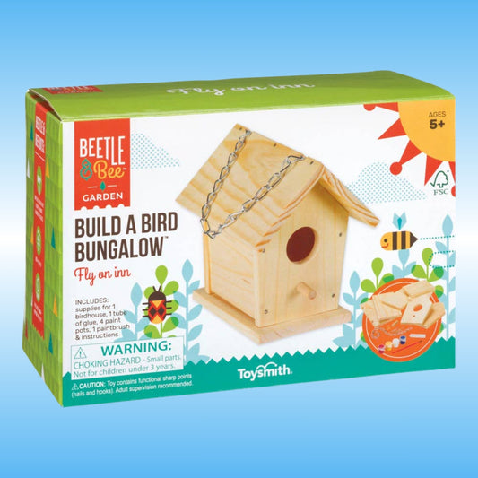Beetle & Bee Garden 'Build a Bird Bungalow' toy kit box by Toysmith, showing a wooden birdhouse on the front with colorful graphics and age 5+ marking on a light blue background.