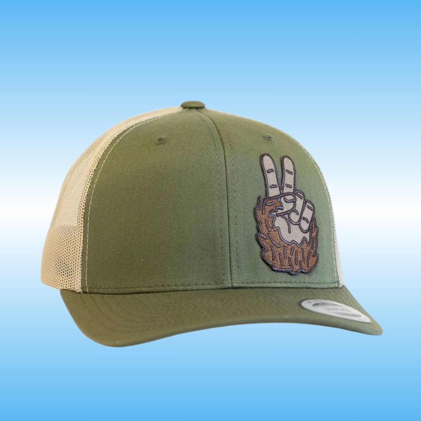 An olive green trucker cap with beige mesh back panels and a graphic patch of the hand of bigfoot making a peace sign on the front, set against a plain white background.
