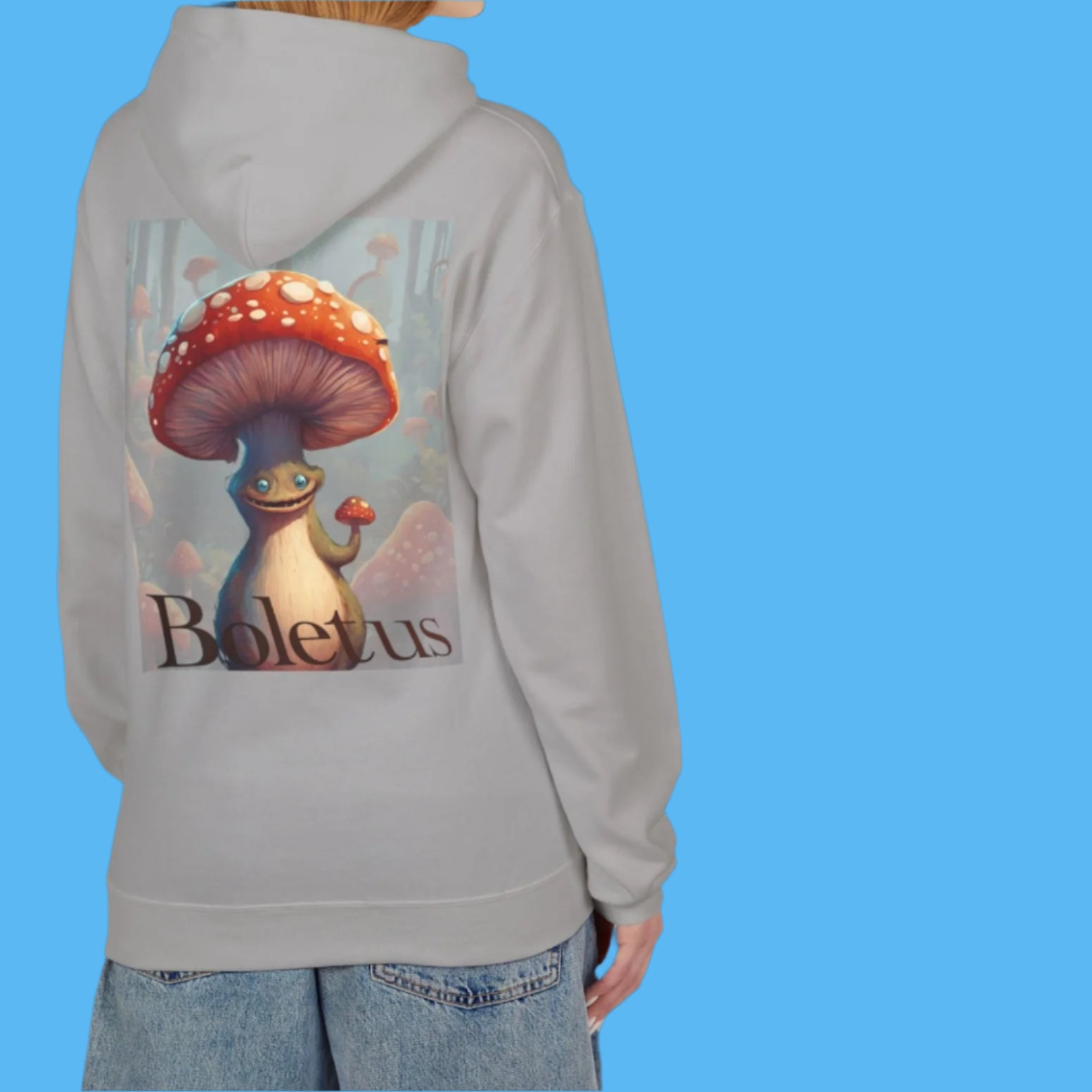 Boletus is calling in this concrete grey Hoodie Paddle Frogs mushroom character graphic hooded jacket with pockets, Boletus on front and back chill out with cement paved gray cozy hood coat Pictured on a lady but this garment is unisex