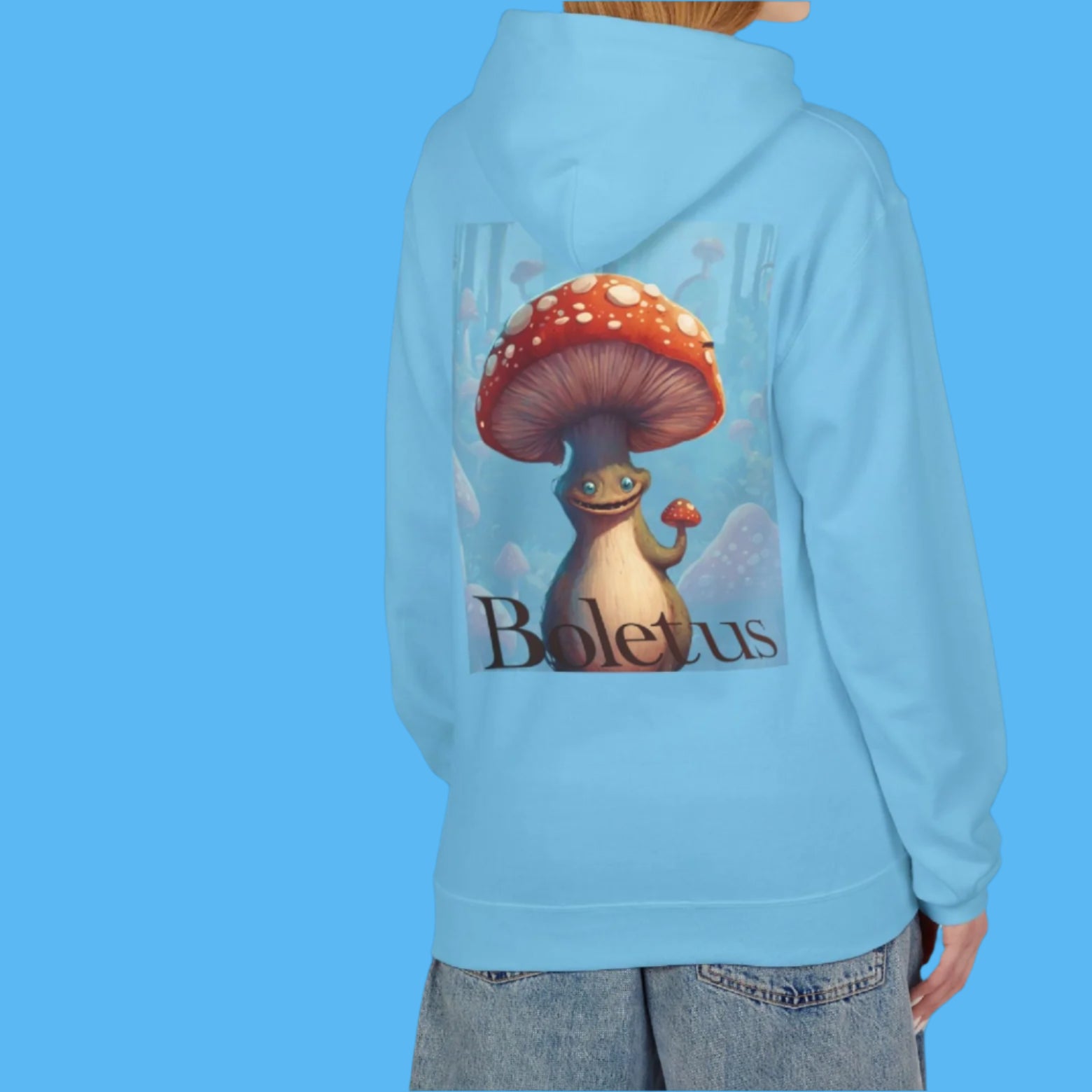 Boletus is calling in this Bright Beautiful Blue Hoodie Paddle Frogs mushroom character graphic hooded jacket with pockets, Boletus on front and back chill out with cement paved Bright Blue cozy hood coat Pictured on a lady but this garment is unisex It's HOT!