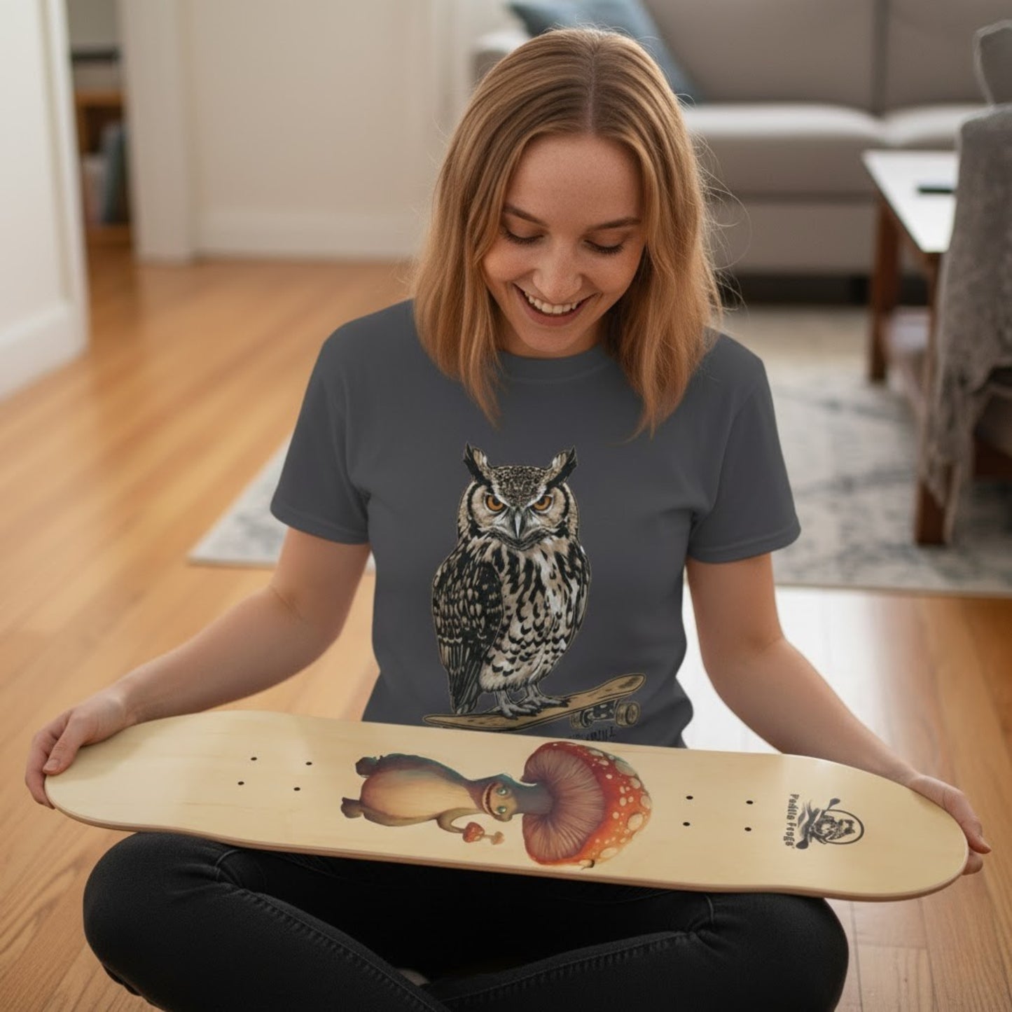 lady sitting crisscross applesauce with her new Boletus skateboard deck by Paddle Frogs Outdoor Gear.