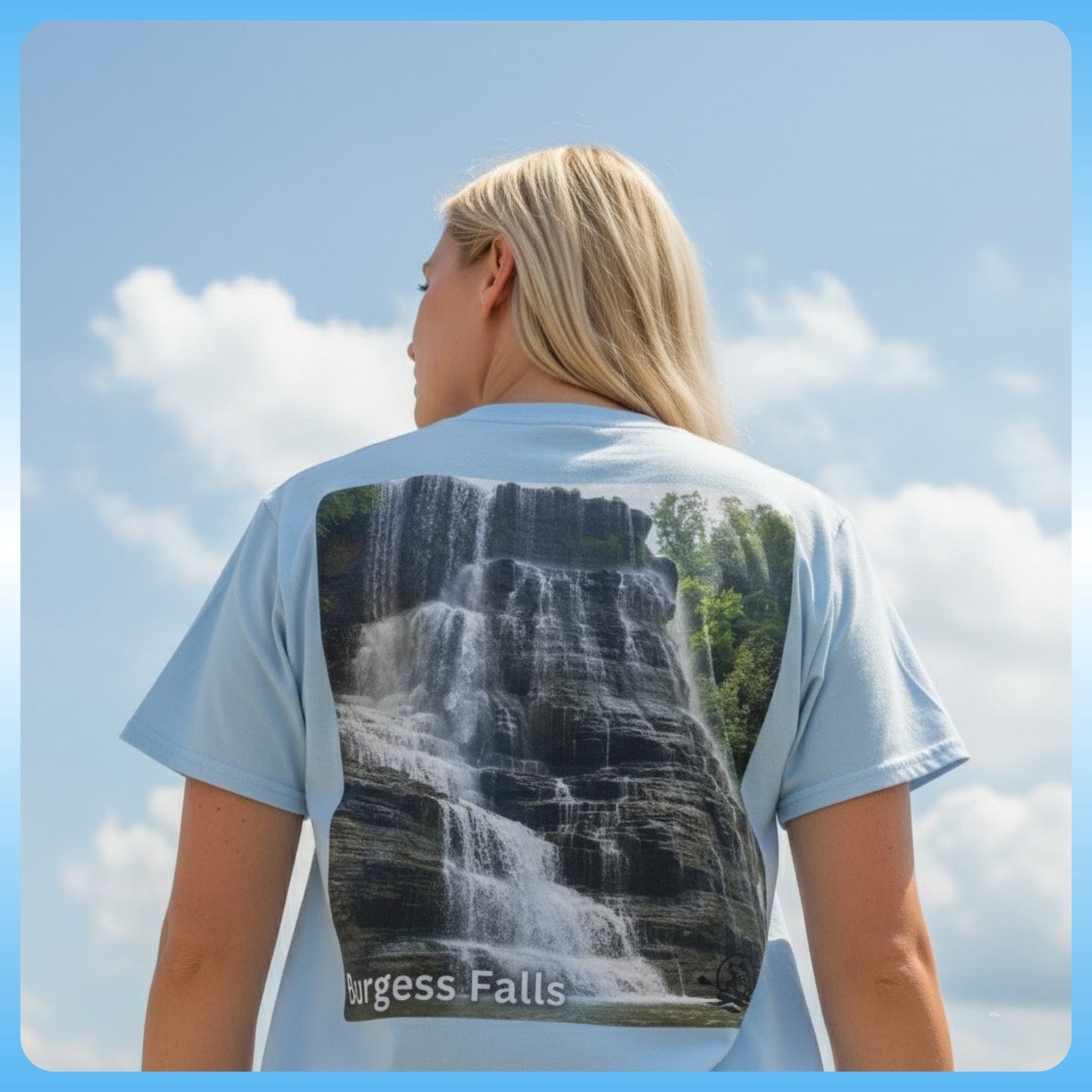 Person wearing a 100% Cotton t-shirt with a waterfall design and 'Burgess Falls' text, standing against a blue sky, Sparta, Tennessee.