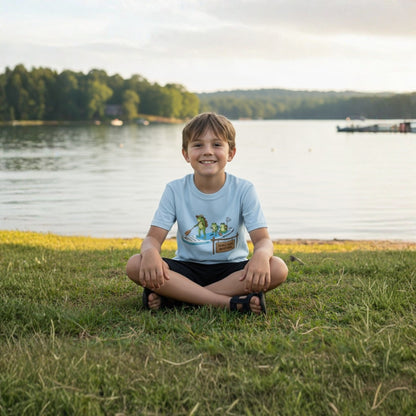 Divine Escape  Adventure Tee - Paddle Frogs™ Kids boy wearing light blue sitting crisscross applesauce at Percy Priest Lake in Tennessee