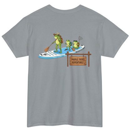 Gray t-shirt with a graphic of frogs paddleboarding and a sign reading 'Paddle Frogs Adventures' on a white background.