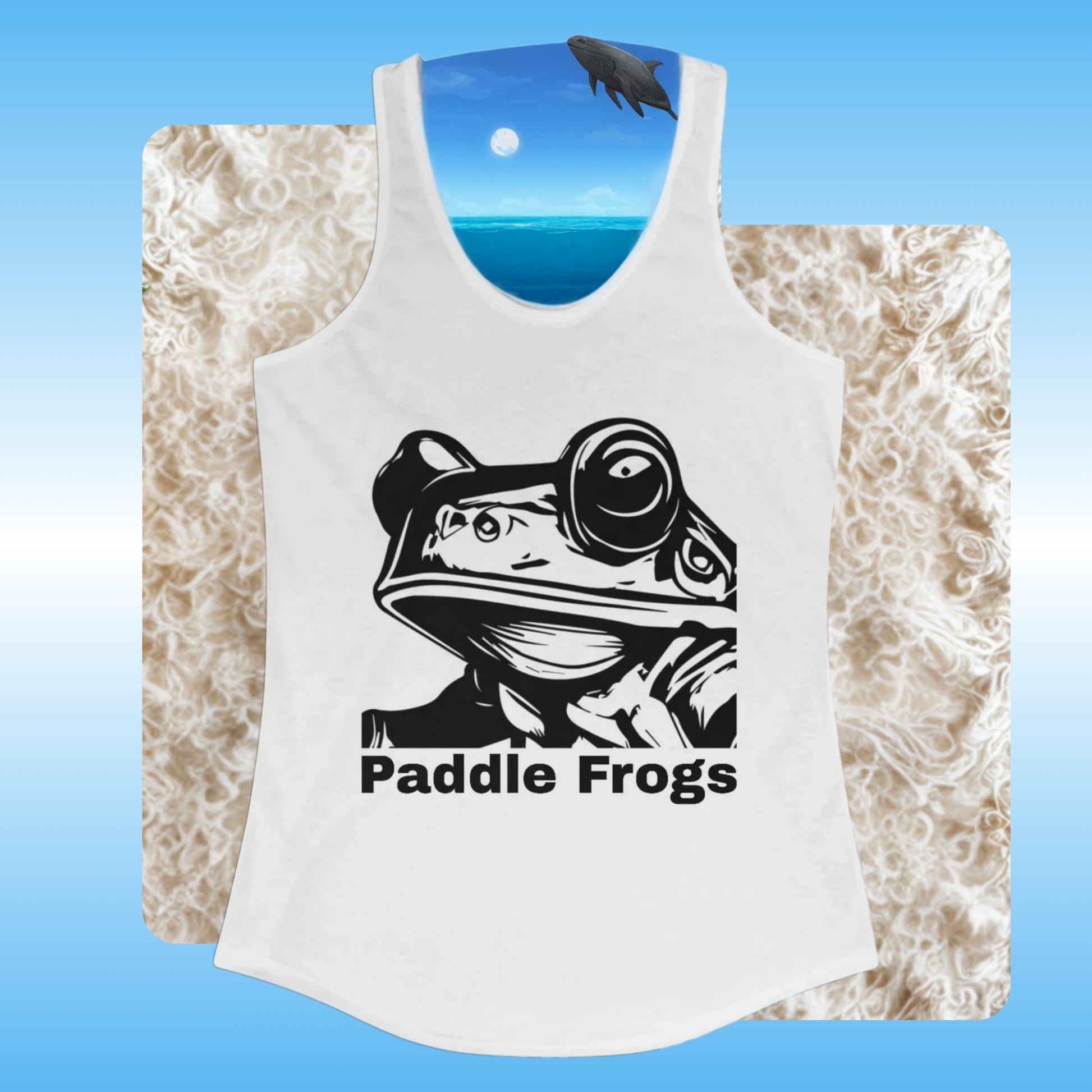 Frog Face | Ladies Tank Top (backdrop) | White tank top with black frog graphic and 'Paddle Frogs' text on a textured surface.