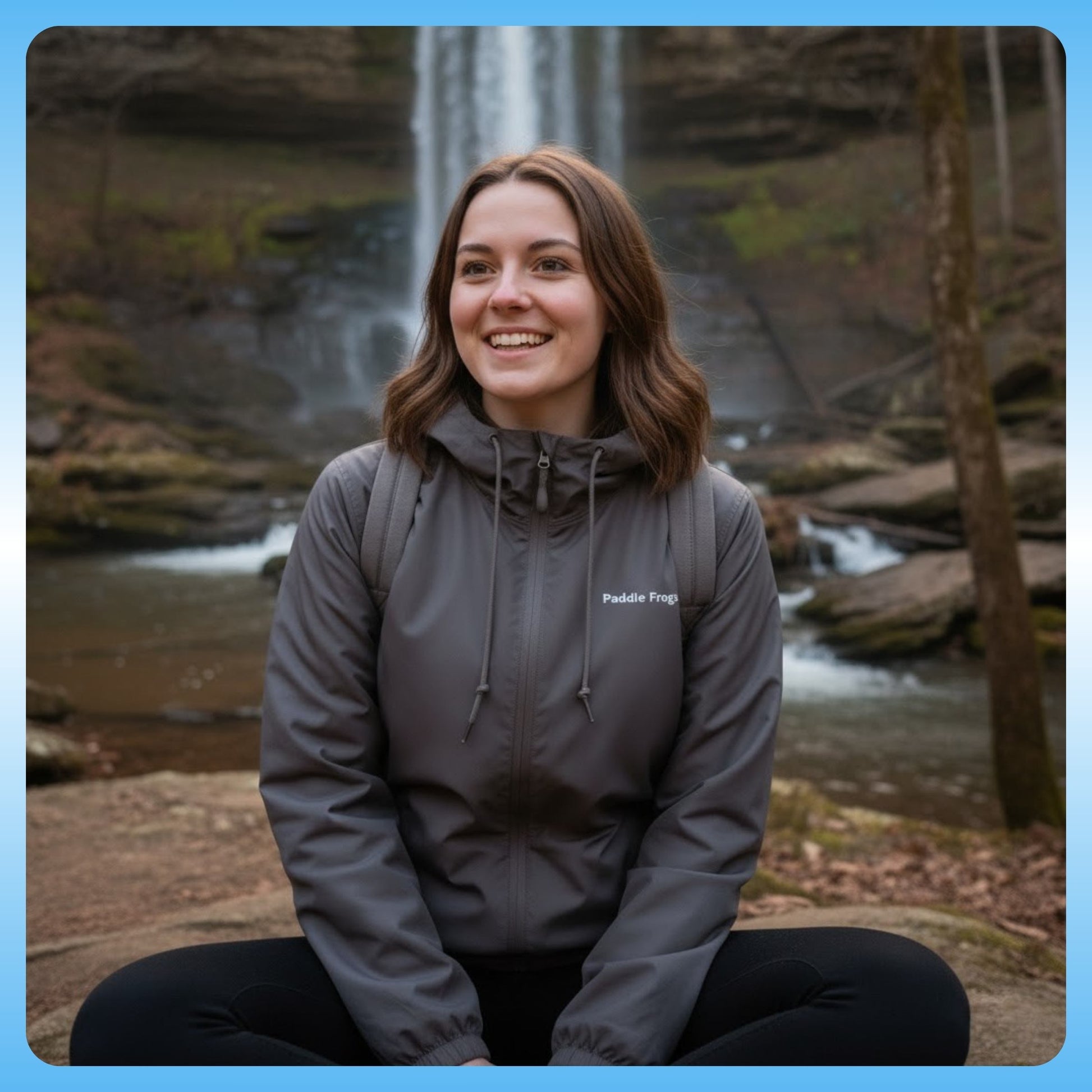 Graphite Windbreaker Hooded Jacket Paddle Frogs™ crisscross applesauce at the waterfall