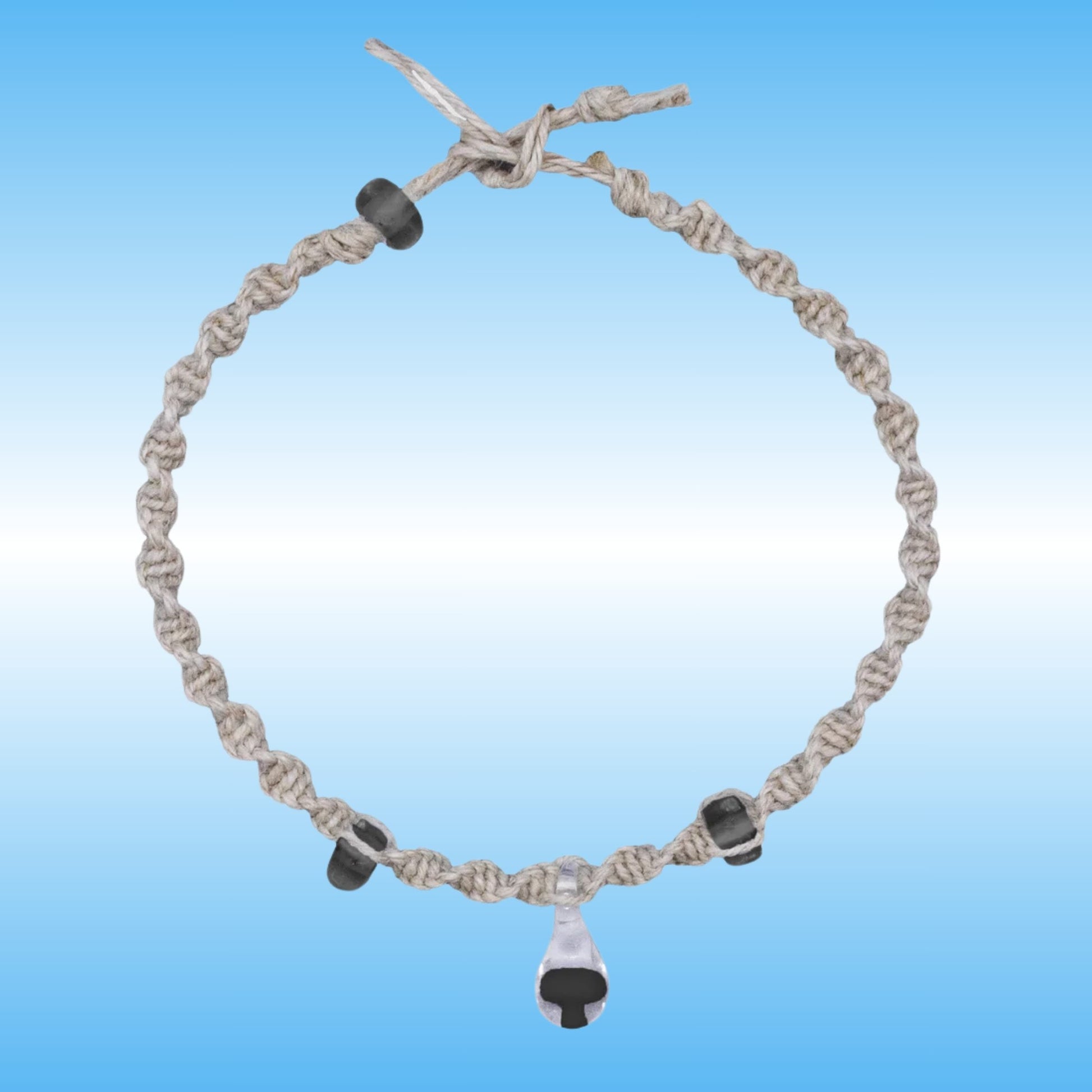 Hand-Braided Hemp Mushroom Anklet or Bracelet with a glass center piece with a black mushroom inside.