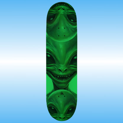 Professional glow in the dark Skateboard deck with green alien design on a blue gradient background