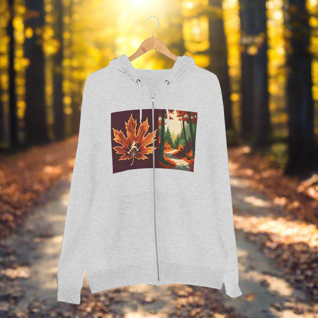 Ice Skate on Autumn Trail Gray hoodie with Zipper and Pockets a maple leaf and forest design on a hanger against a white background