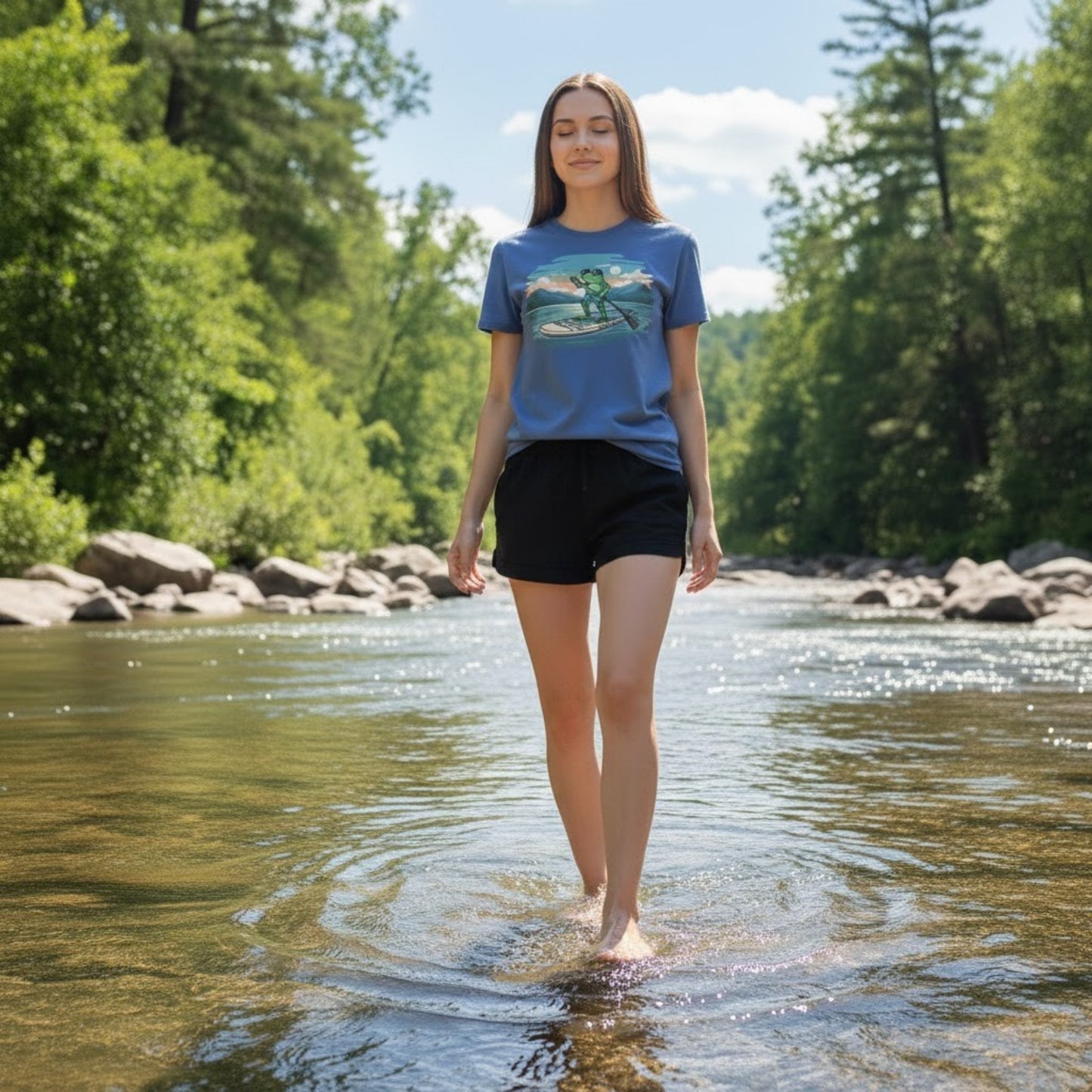 Lady walking in the river wearing the Iris Blue Lake Day Paddleboarding Frog by Paddle Frogs™