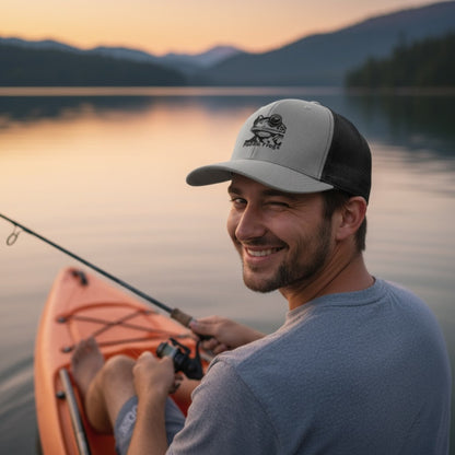 Male  fishing winking and wearing Paddle Frogs™ Snapback Cap heather grey and black vented mesh