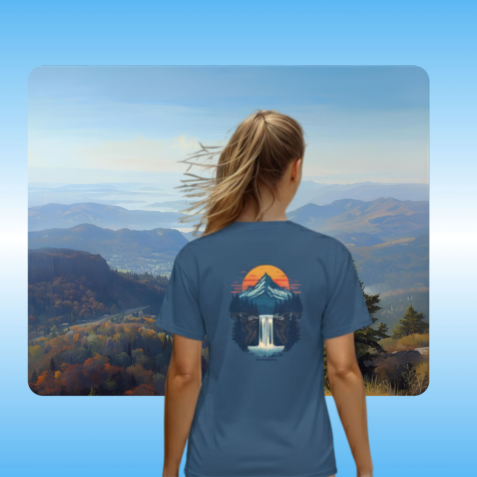 Mountain View t-shirt by Paddle Frogs | Lady model Faded Navy Blue | Person wearing a blue t-shirt with a nature graphic, standing in front of a scenic mountain view.