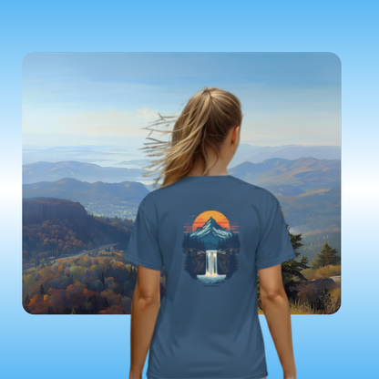 Mountain View t-shirt by Paddle Frogs | Lady model Faded Navy Blue | Person wearing a blue t-shirt with a nature graphic, standing in front of a scenic mountain view.