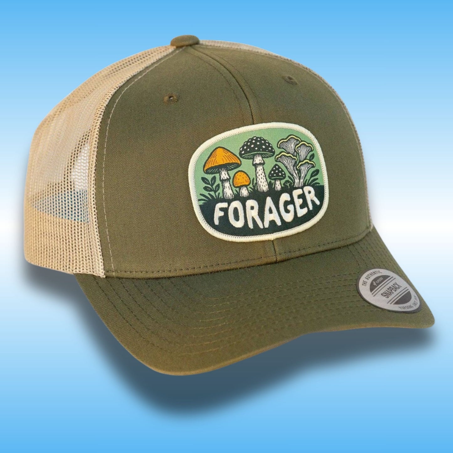 An olive green and beige trucker hat with a mushroom patch on the front that reads 'FORAGER'.
