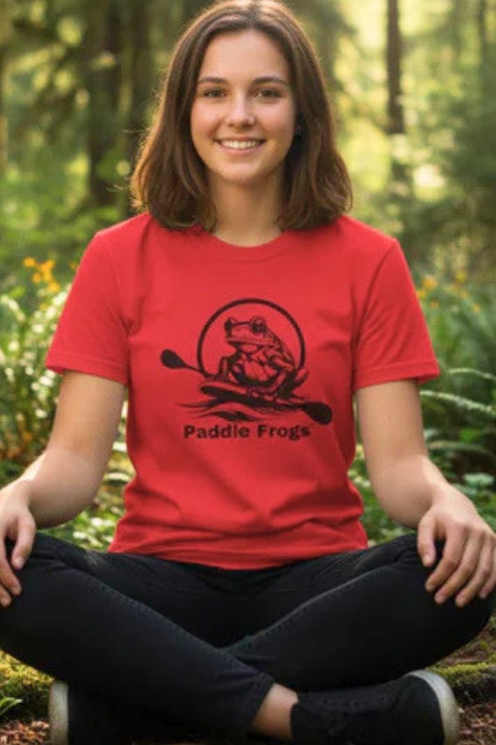 Young lady sitting crisscross applesauce in the forest. She is wearing the Original Paddleboarding T-Shirt (12 colors) Red by Paddle Frogs outdoor gear