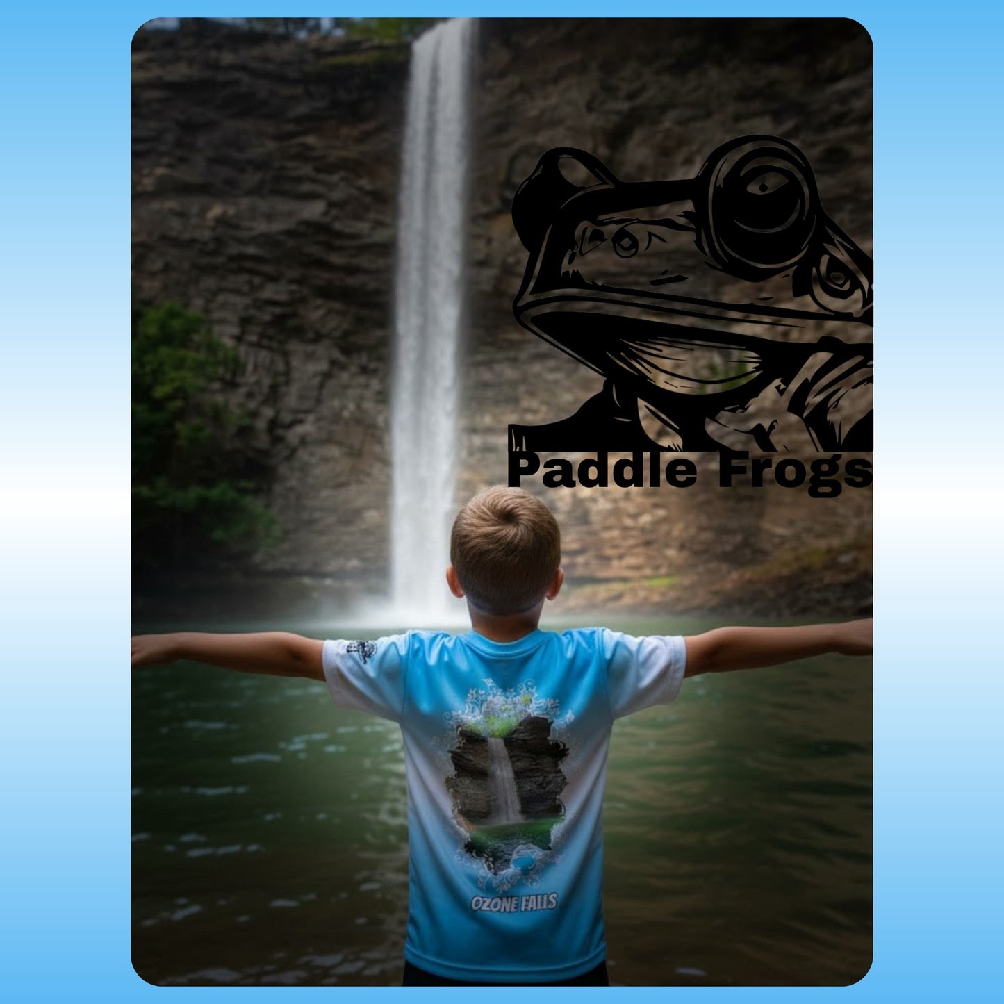 Person wearing a blue t-shirt with a frog design in front of a waterfall, featuring 'Paddle Frogs' branding. at Ozone Falls in Tennessee
