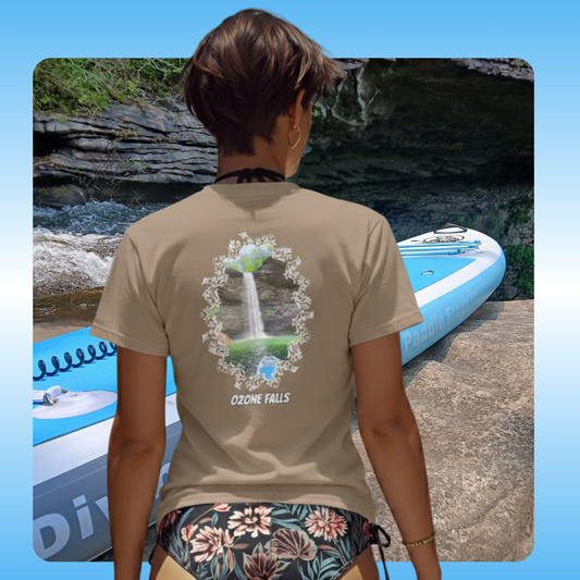 Ozone Falls faded brown Tee by Paddle Frogs Outdoor Gear the waterfall is in Rockwood Tennessee Person wearing a t-shirt with a waterfalls design and text, standing near a paddleboard on a natural setting.