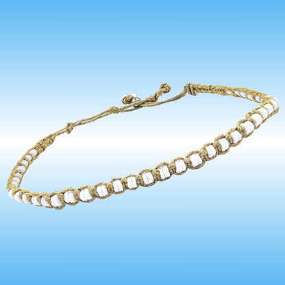 A handmade braided cord anklet with white shell beads, displayed against a blue gradient background.