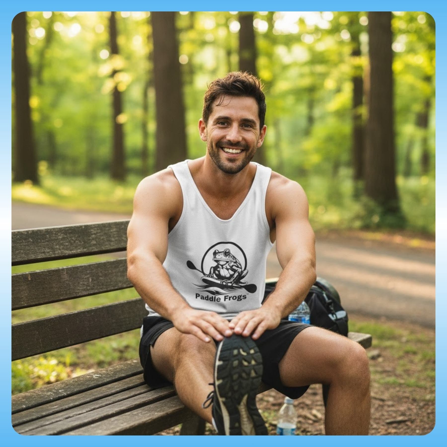 Paddle Frogs™ Men’s Tank Top stretch before running or exercise is important - Man sitting on a bench in a park wearing a tank top with a Paddle Frogs logo.