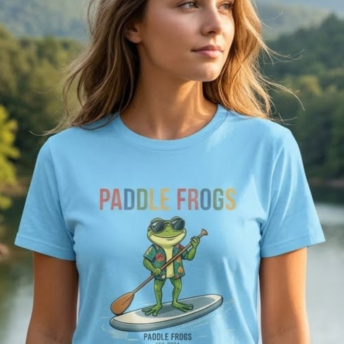 A young lady wearing the Paddling Frog Tee by Paddle Frogs Outdoor Gear brand a frog paddling in glasses and a vacation Hawaiian shirt Sky Blue t-shirt