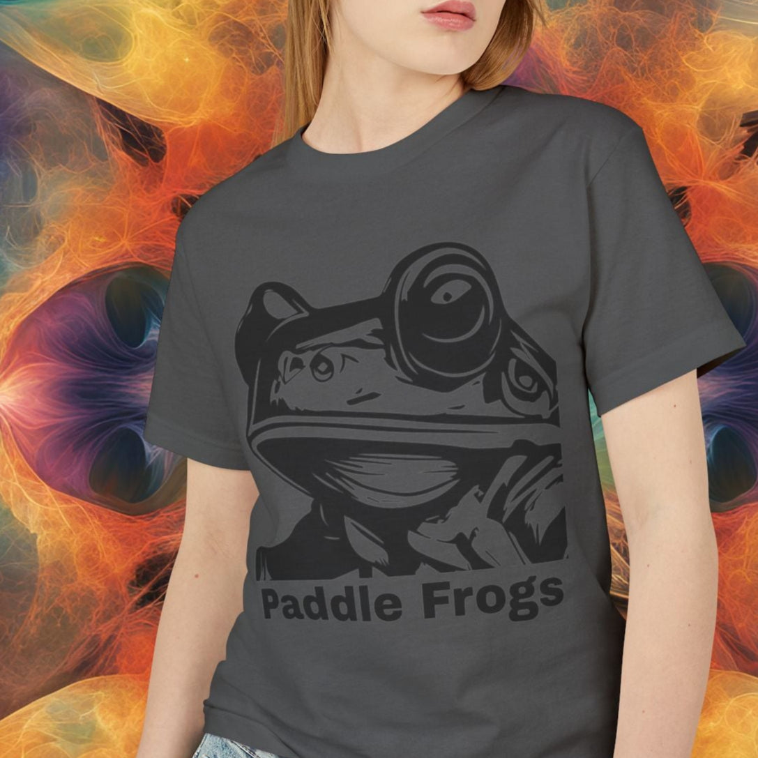 Person wearing a t-shirt with 'Paddle Frogs' design against a colorful abstract background Olive Chaos vs Sea Queen front side with face
