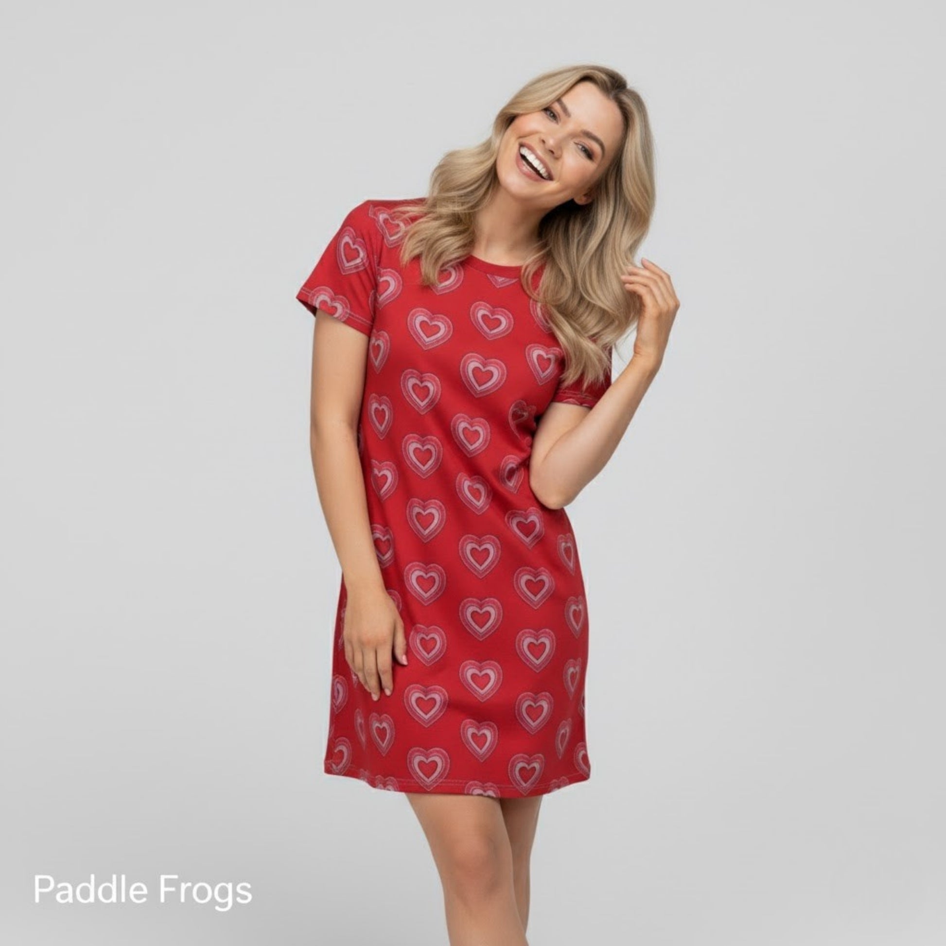 Red Heart Love Tee Dress Paddle Frogs model, showcasing a relaxed, happy, and vibrant demeanor in the dress.