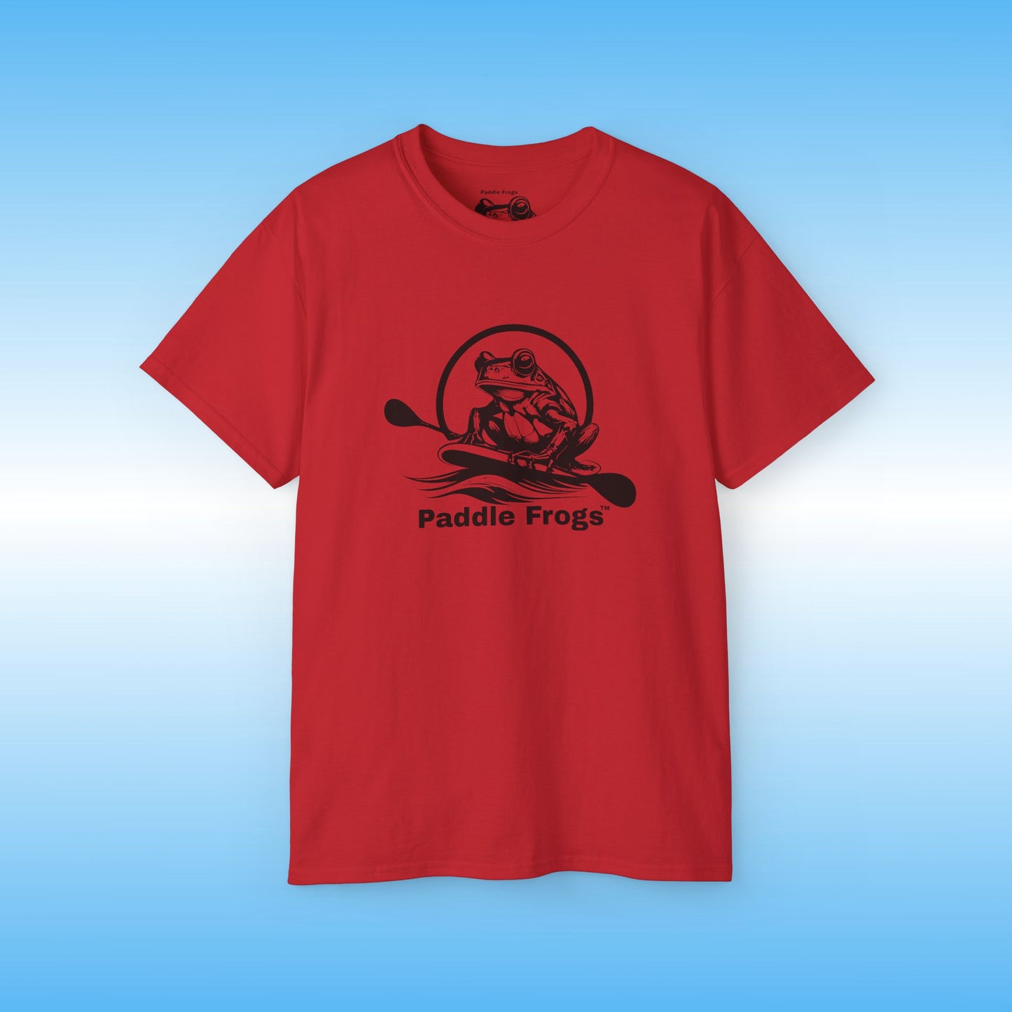 Red t-shirt with black graphic and text 'Paddle Frogs' on a blue background