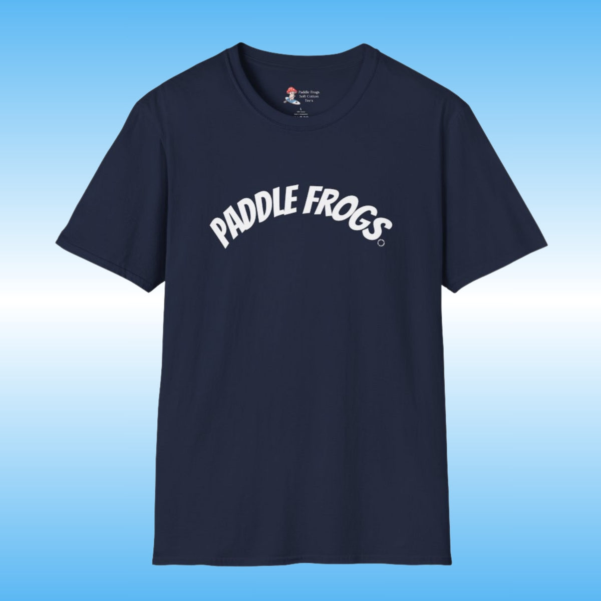 A navy blue short-sleeve crewneck soft cotton t-shirt featuring the words 'PADDLE FROGS' printed in white arched text across the chest, displayed against a light blue gradient background.