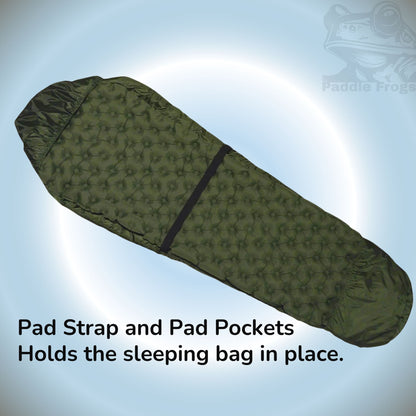 Sleeping bag with strap and pockets to hold the soft sleeping pad in place all night while you rest.