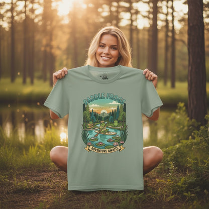 Sage color held by our model at sunrise - Adventure Awaits | Paddle Frogs: T-shirt