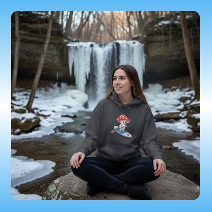 Shiro rides the Divine Escape Paddle Frogs™ Hoodie – Charcoal Gray Woman sitting by a frozen waterfall wearing a hoodie with a cartoon design.
