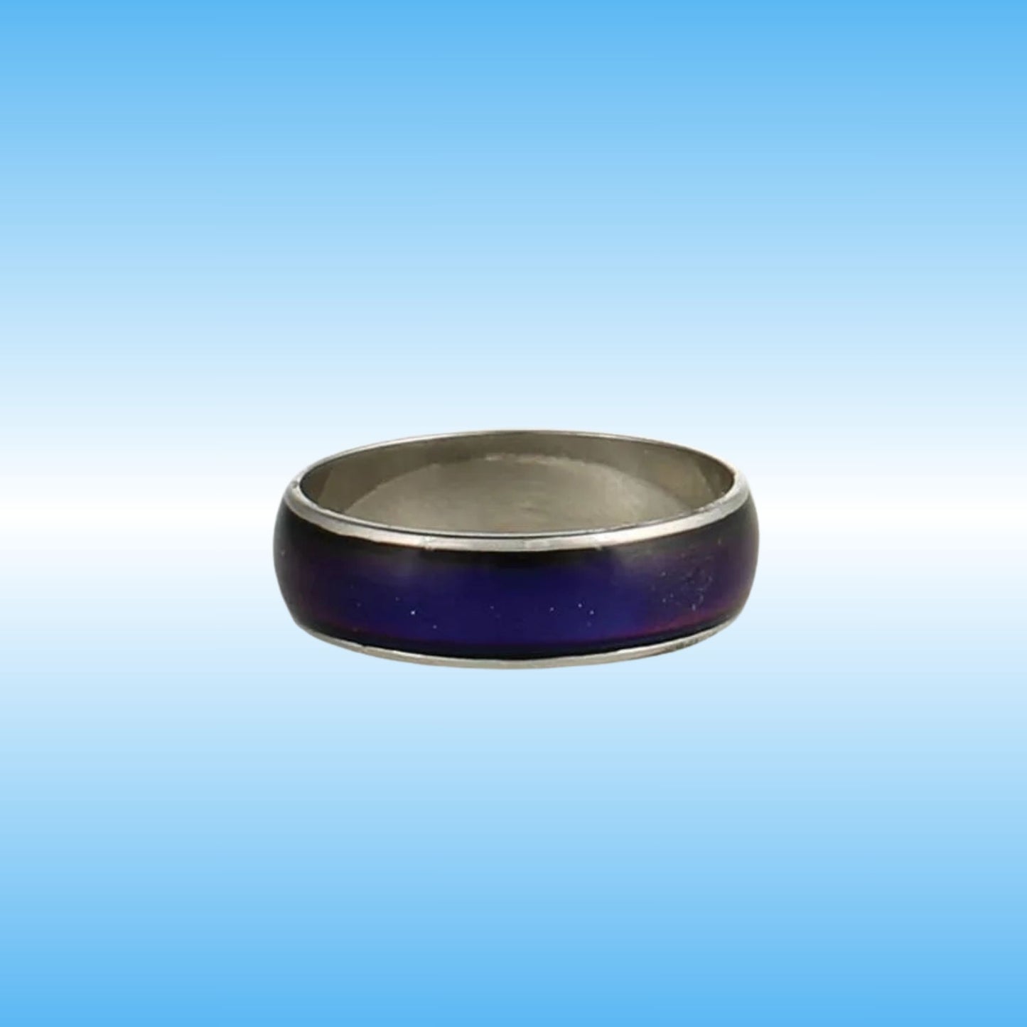 A silver-toned metal ring with a dark purple inlay, shown against a blue gradient background.