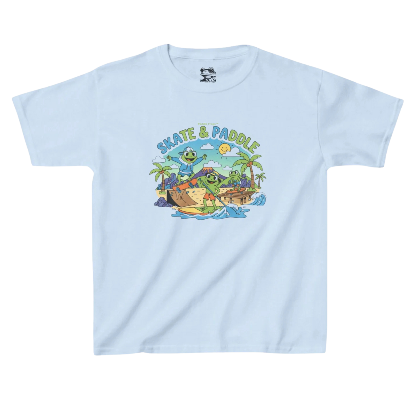 Skate & Paddle Paddle Frogs Kids | Light blue t-shirt with a graphic design of a beach scene, volcano, paddle board, skateboarding and 'Skate & Paddle' text on a white background.