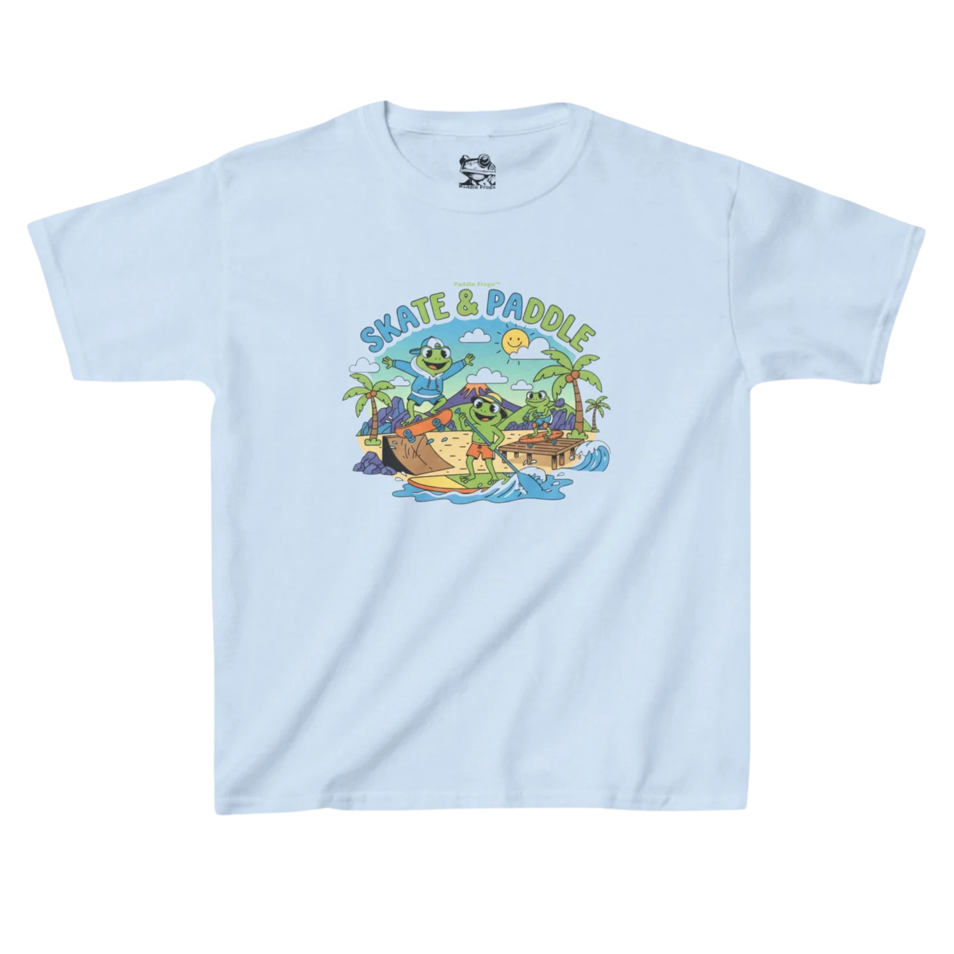 Skate & Paddle Paddle Frogs Kids | Light blue t-shirt with a graphic design of a beach scene, volcano, paddle board, skateboarding and 'Skate & Paddle' text on a white background.