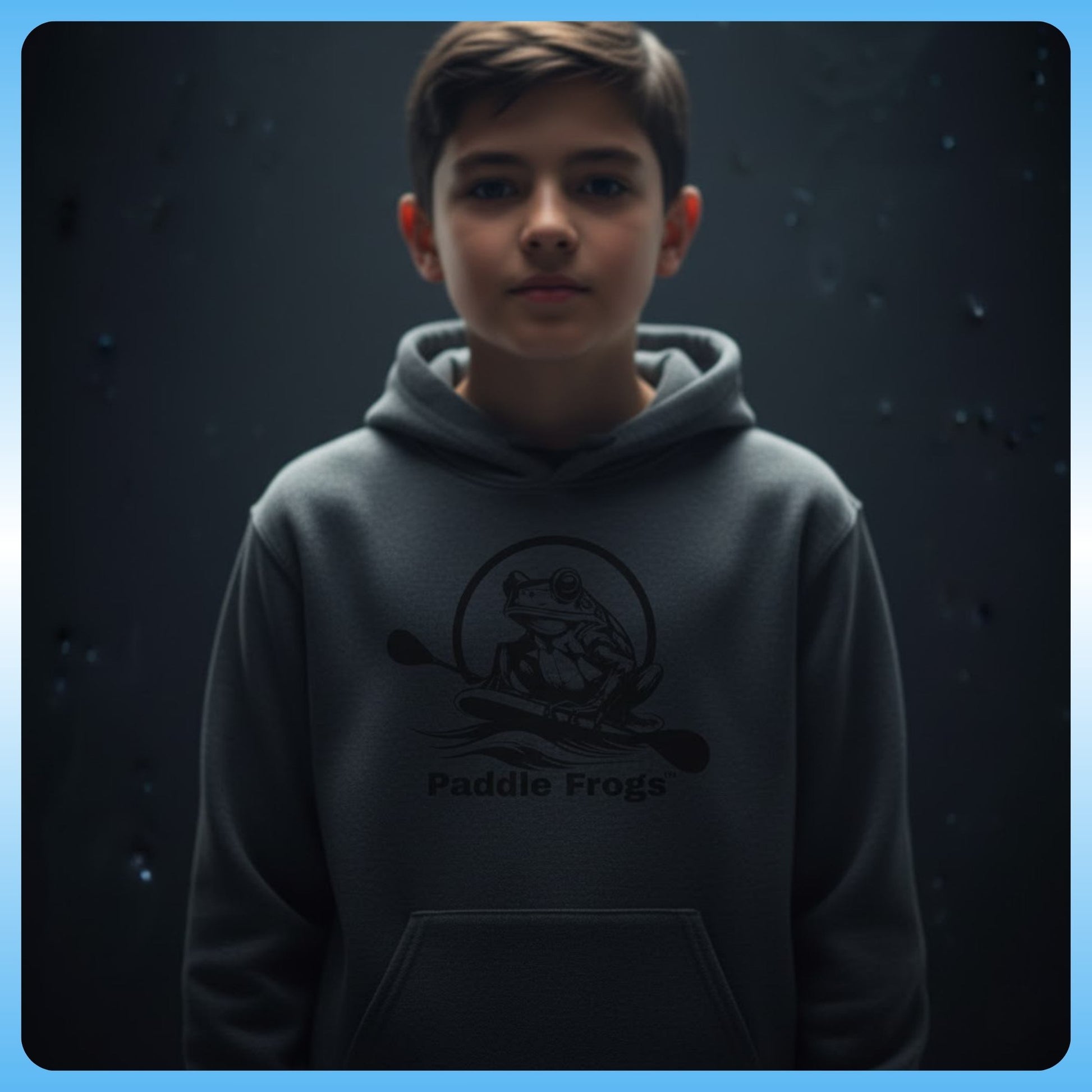 Super Strange | Youth Hooded Sweatshirt | Paddle Frogs™ Child wearing a hoodie with 'Paddle Frogs' logo against a dark background