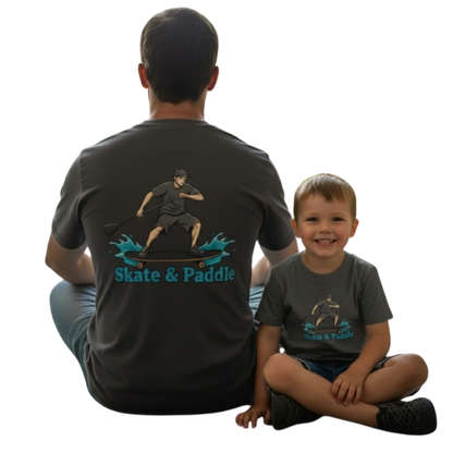 Man and child wearing matching 'Skate & Paddle' t-shirts by Paddle Frogs on a transparent background
