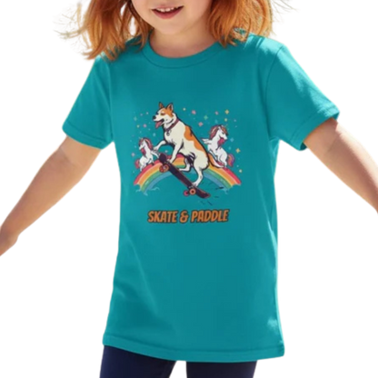 Child wearing a teal t-shirt with a graphic design of a dog and unicorn on a rainbow, with 'Skate & Paddle' text on a transparent background