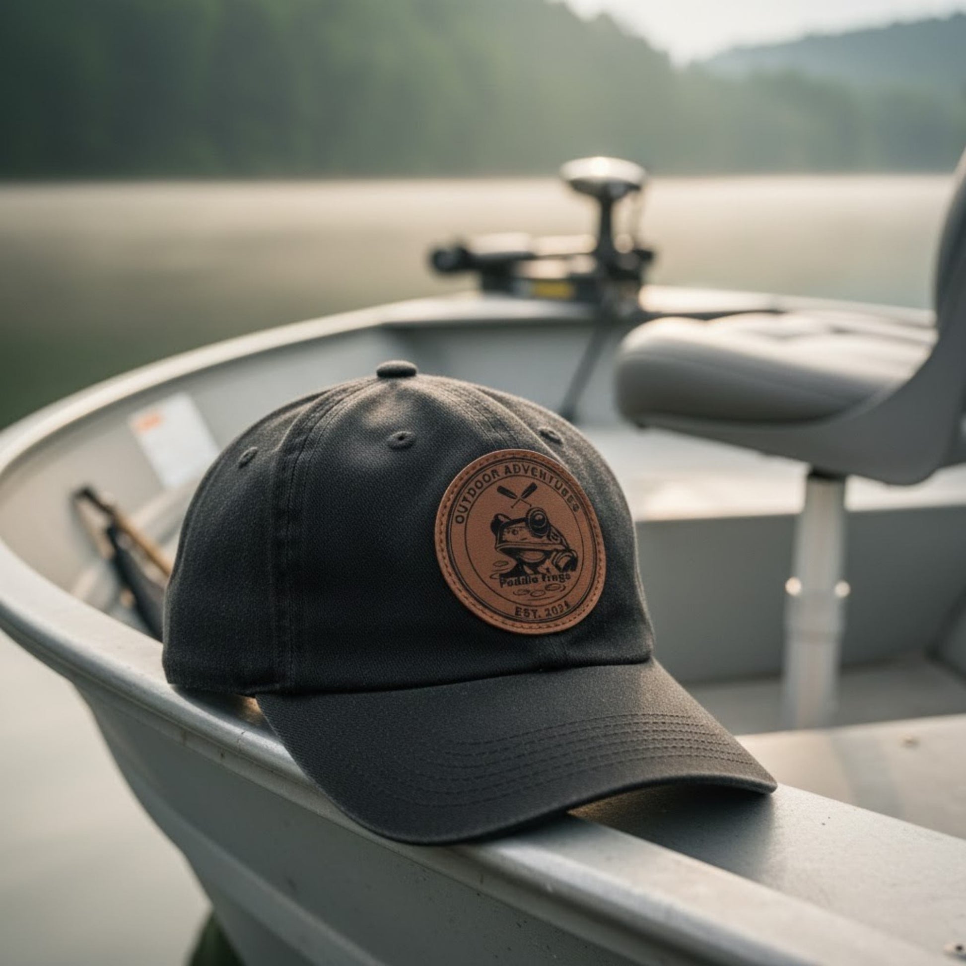 Black cap with a leather patch on a boat on a lake