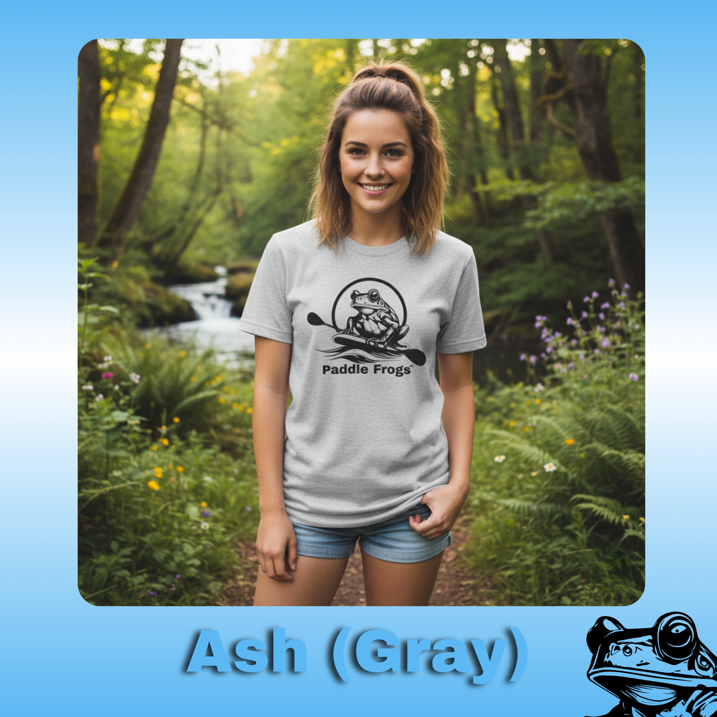 The Original Paddle Boarding T-Shirt | Paddle Frogs™ Ash Gray Tee | Woman wearing a 'Paddle Frogs' t-shirt in a forest setting with 'Ash (Gray)' text at the bottom.