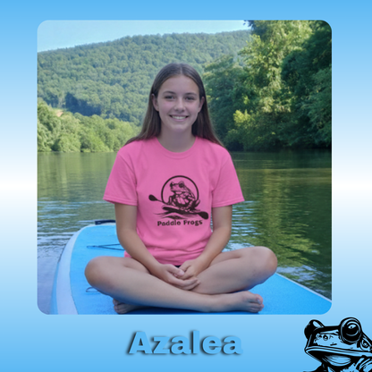 The Original Paddle Boarding T-Shirt | Paddle Frogs™ Azalea color Tee | Teenager wearing pink t-shirt sitting on a paddle board in a scenic location
