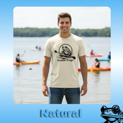 The Original Paddle Boarding T-Shirt | Paddle Frogs™ Natural Tee | Man wearing a 'Paddle Frogs' t-shirt with a lake and kayakers in the background