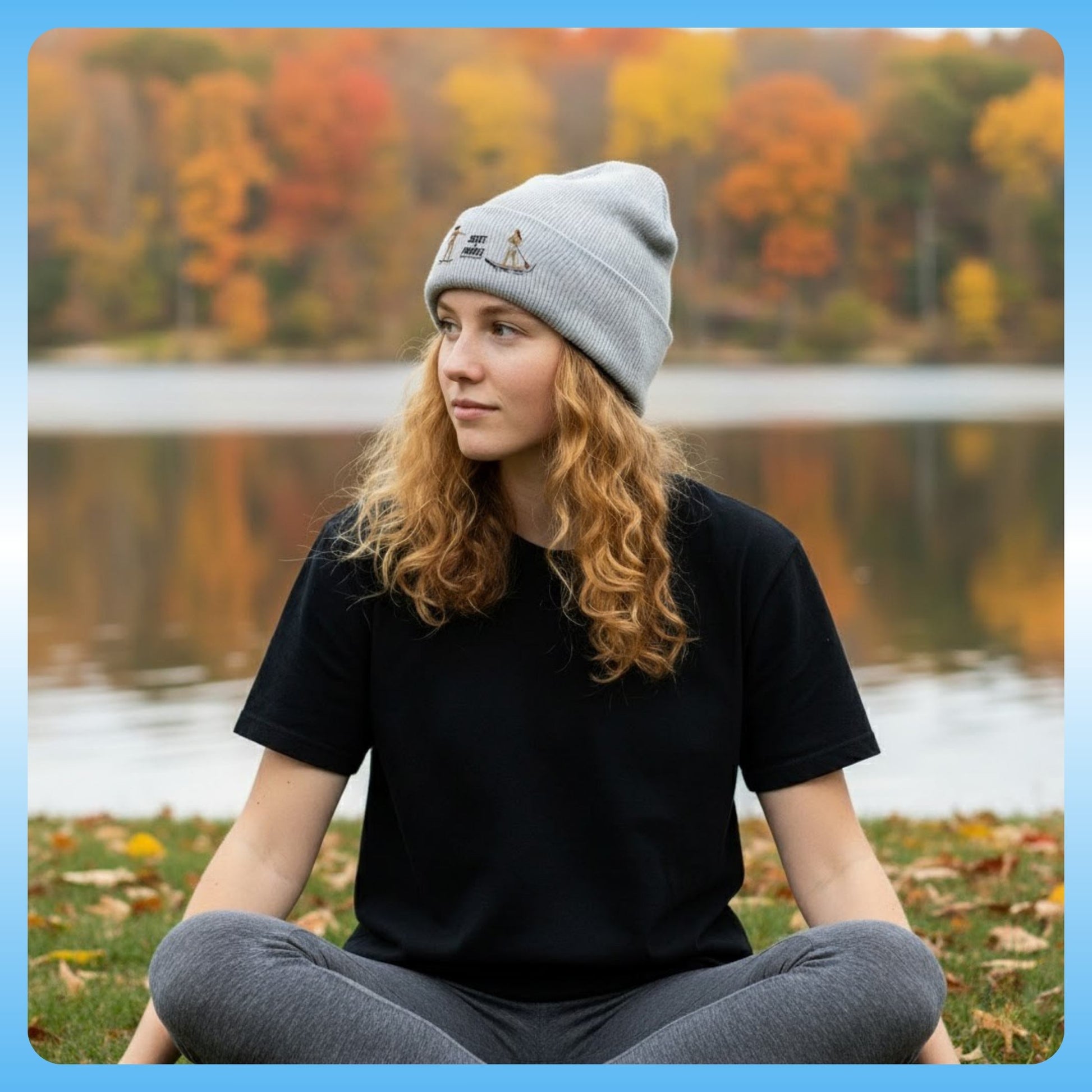 Tides & Trails Beanie: Life in Balance, Skate & Paddle Gray crisscross applesauce Person sitting by a lake with autumn foliage in the background