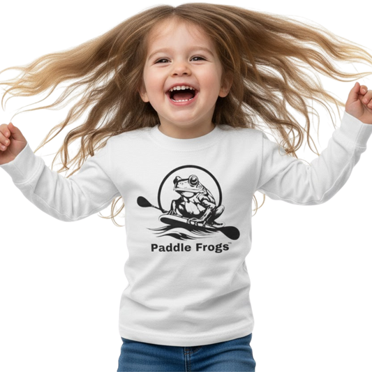 Child wearing a white long-sleeve shirt with 'Paddle Frogs' logo on a transparent background