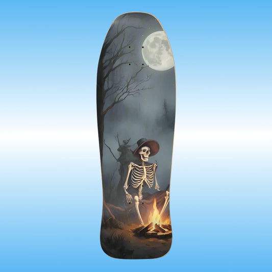 Warm Your Bones - Paddle Frogs  - Skateboard deck with a skeleton by a campfire and moonlit sky design on a blue gradient background.