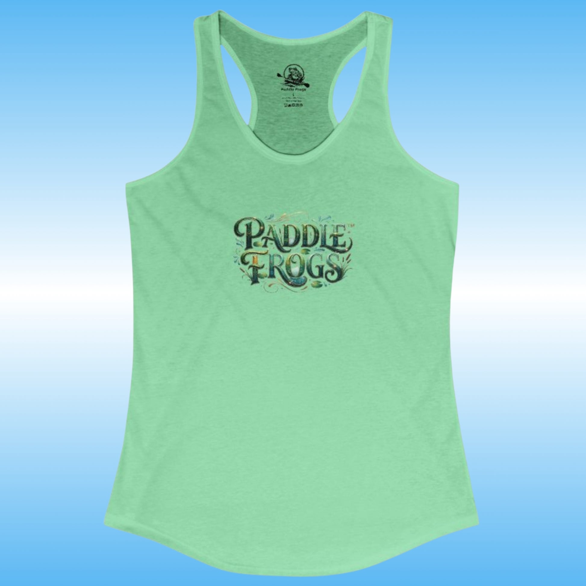 A mint green racerback tank top featuring a 'Paddle Frogs' graphic on the chest, displayed against a blue gradient background.