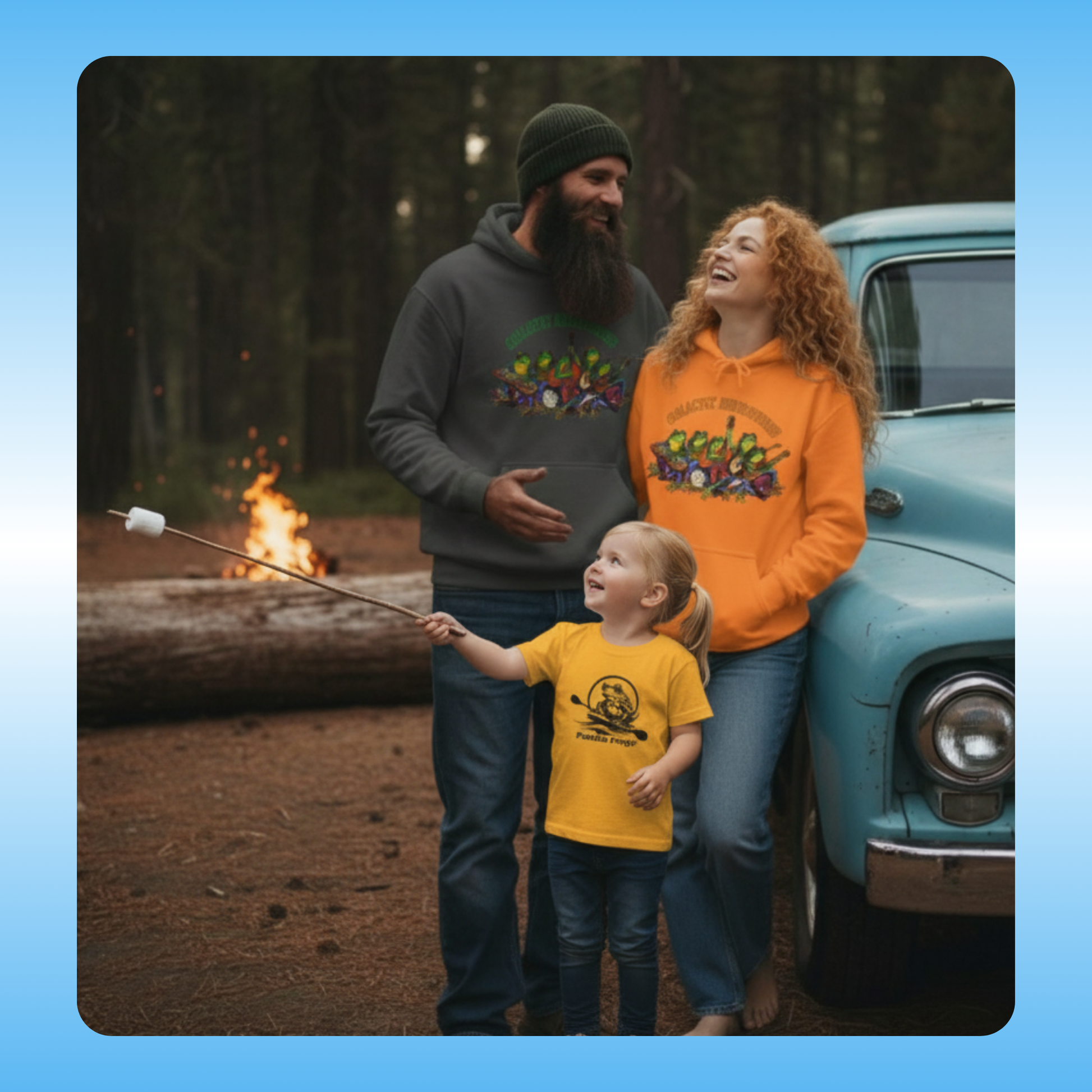 Yellow toddler Paddle Frogs Tee and Ladies blue Paddle Frogs t-shirt dress Family of three by a campfire with a vintage truck in the woods