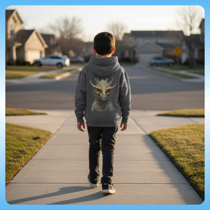 Zacharias Youth Hoodie — Paddle Frogs Kids - Dark Heather - Child wearing a hoodie with a dragon design walking on a sidewalk in a suburban neighborhood.