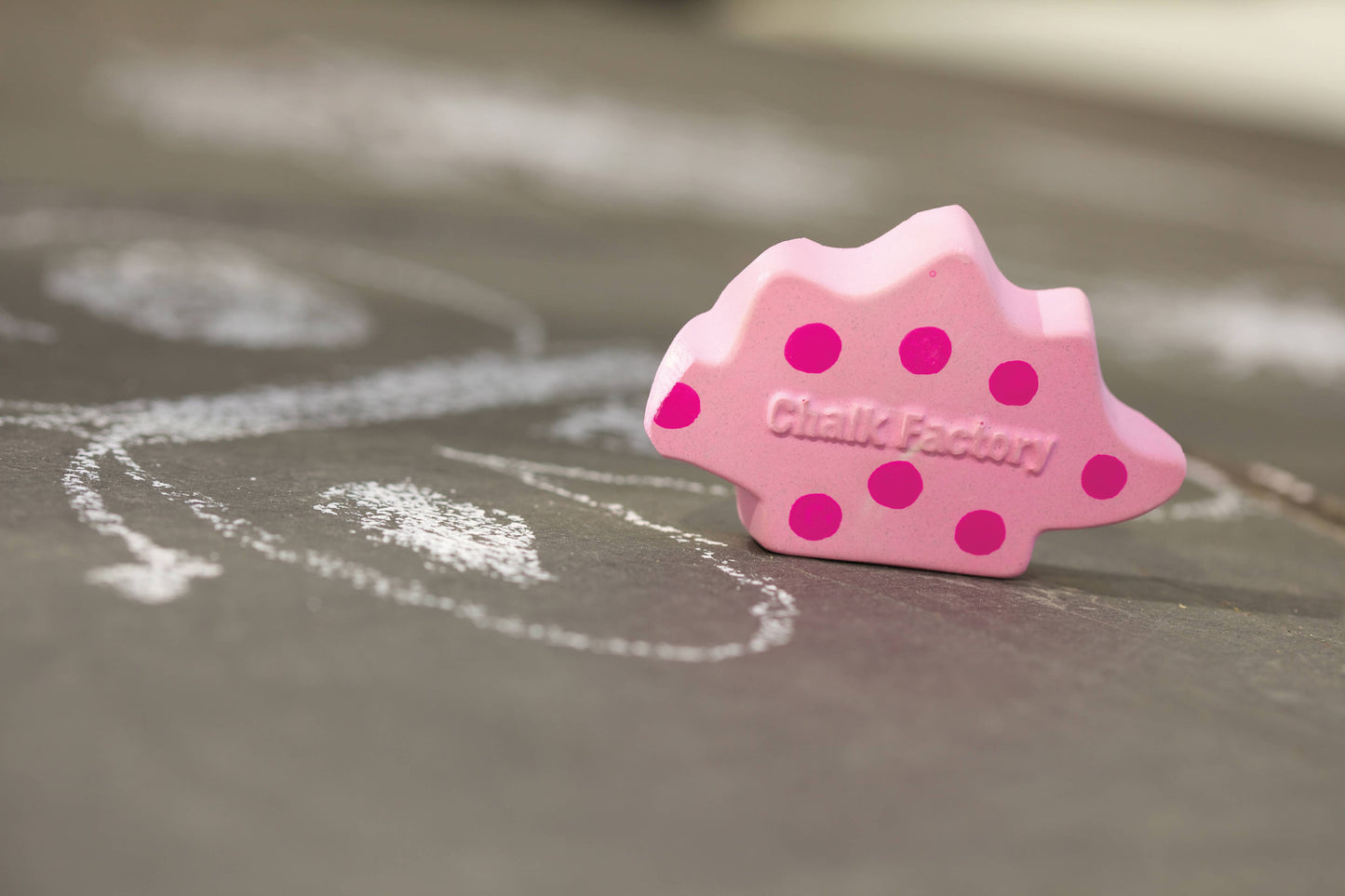 Pink hedgehog-shaped chalk with 'Chalk Factory' branding on a chalkboard surface.