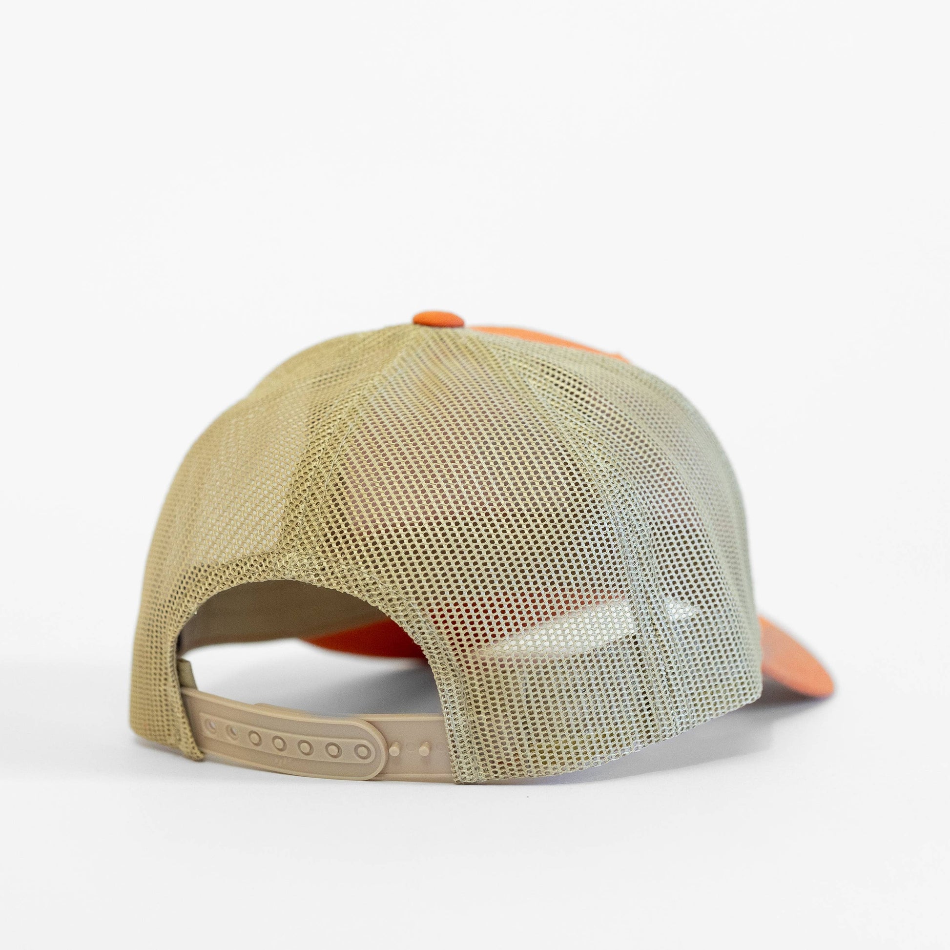 Beige and orange cap with mesh back on a white background